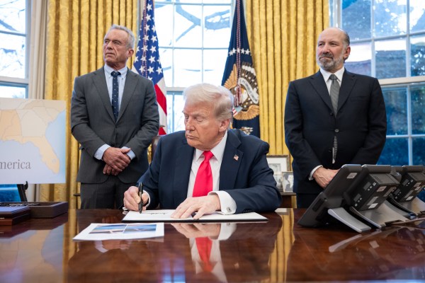 President Donald Trump signs executive orders in the Oval Office, Tuesday, February 25, 2025. (Official White House Photo by Molly Riley)