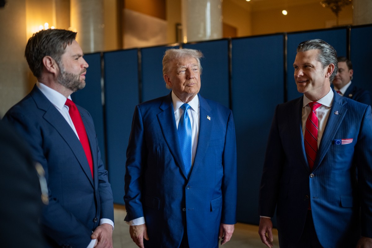 President Donald Trump speaks with Vice President JD Vance and Defense Secretary Pete Hegseth before the Memorial Day ceremony at Arlington National Cemetery, Monday, May 26, 2025, in Arlington, Virginia. (Official White House Photo by Daniel Torok)