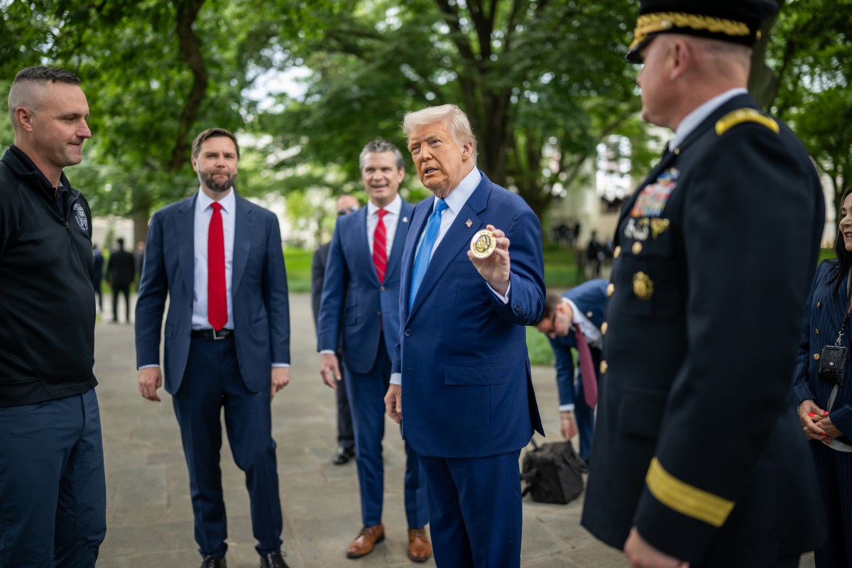 President Donald Trump speaks with members of the military before departing Arlington National Cemetery in Arlington, Virginia after participating in Memorial Day ceremonies, Monday, May 26, 2025. (Official White House Photo by Daniel Torok)