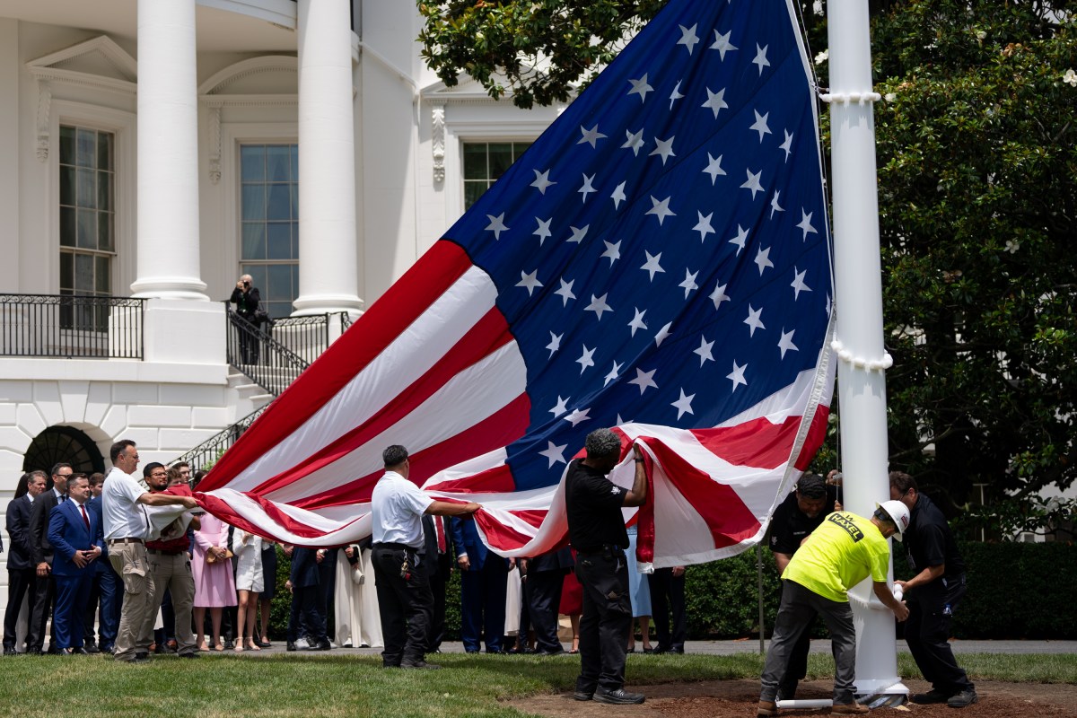 President Donald Trump watches the United States flag is raised on the newly installed flagpole on the South Lawn of the White House, Wednesday, June 18, 2025. (Official White House Photo by Andrea Hanks)