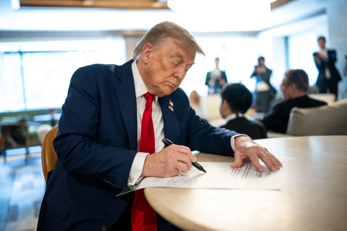 President Donald Trump signs a document at the the G7 Summit, Monday, June 16, 2025, in Kananaskis, Alberta, Canada. (Official White House Photo by Daniel Torok)