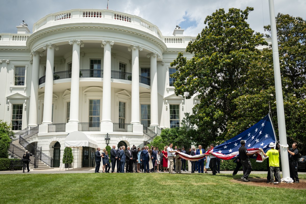 President Donald Trump watches as the American flag is raised on the newly-installed flagpole on the South Lawn of the White House, Wednesday, June 18, 2025. (Official White House Photo by Daniel Torok)