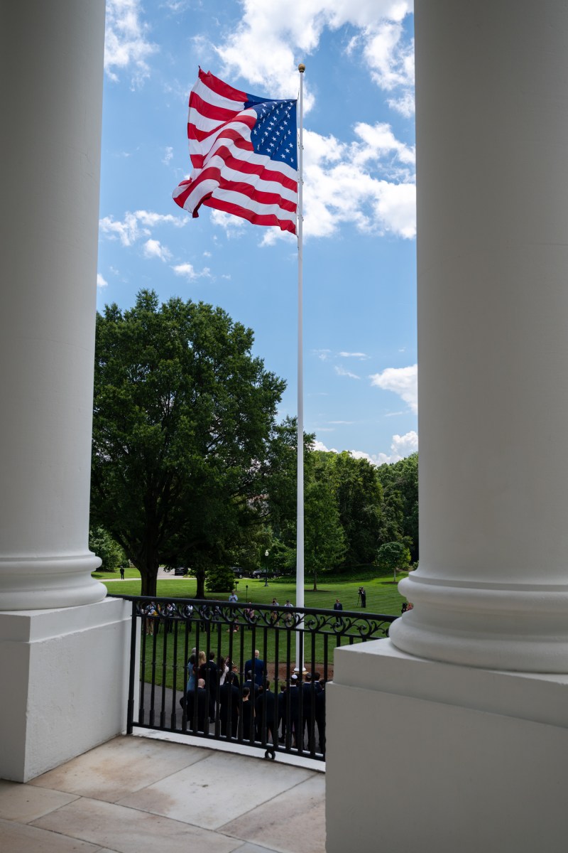 President Donald Trump watches as the American flag is raised on the newly-installed flagpole on the South Lawn of the White House, Wednesday, June 18, 2025. (Official White House Photo by Molly Riley)