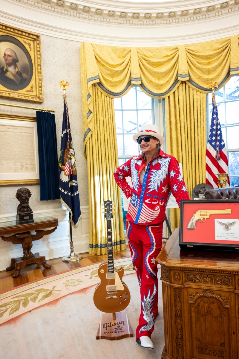 President Donald Trump signs an Executive Order alongside Kid Rock in the Oval Office, Monday, March 31, 2025. (Official White House Photo by Molly Riley)