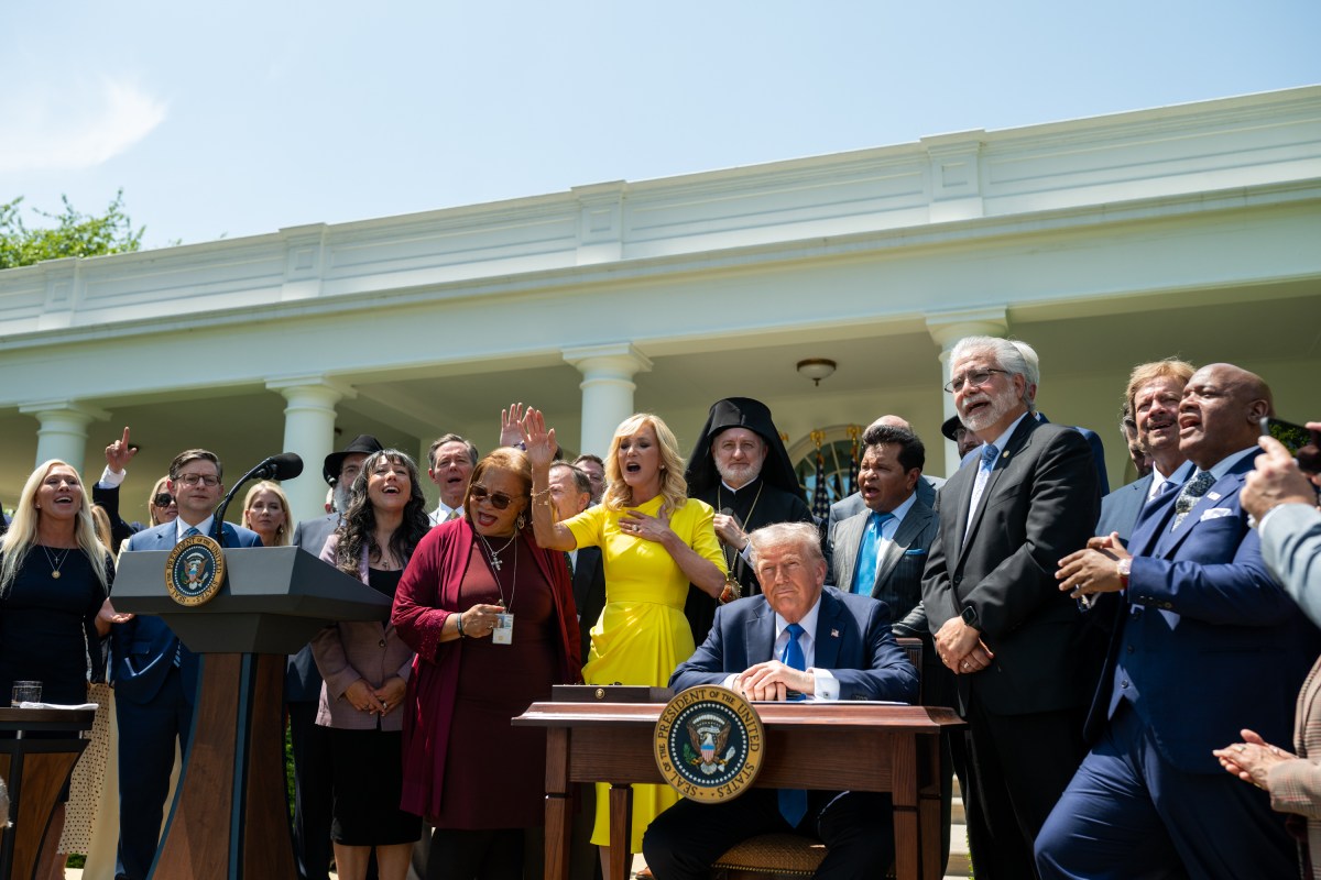 President Donald Trump prepares to sign an Executive Order alongside religious leaders at a National Day of Prayer event, Thursday, May 1, 2025, in the White House Rose Garden. (Official White House Photo by Joyce N. Boghosian)