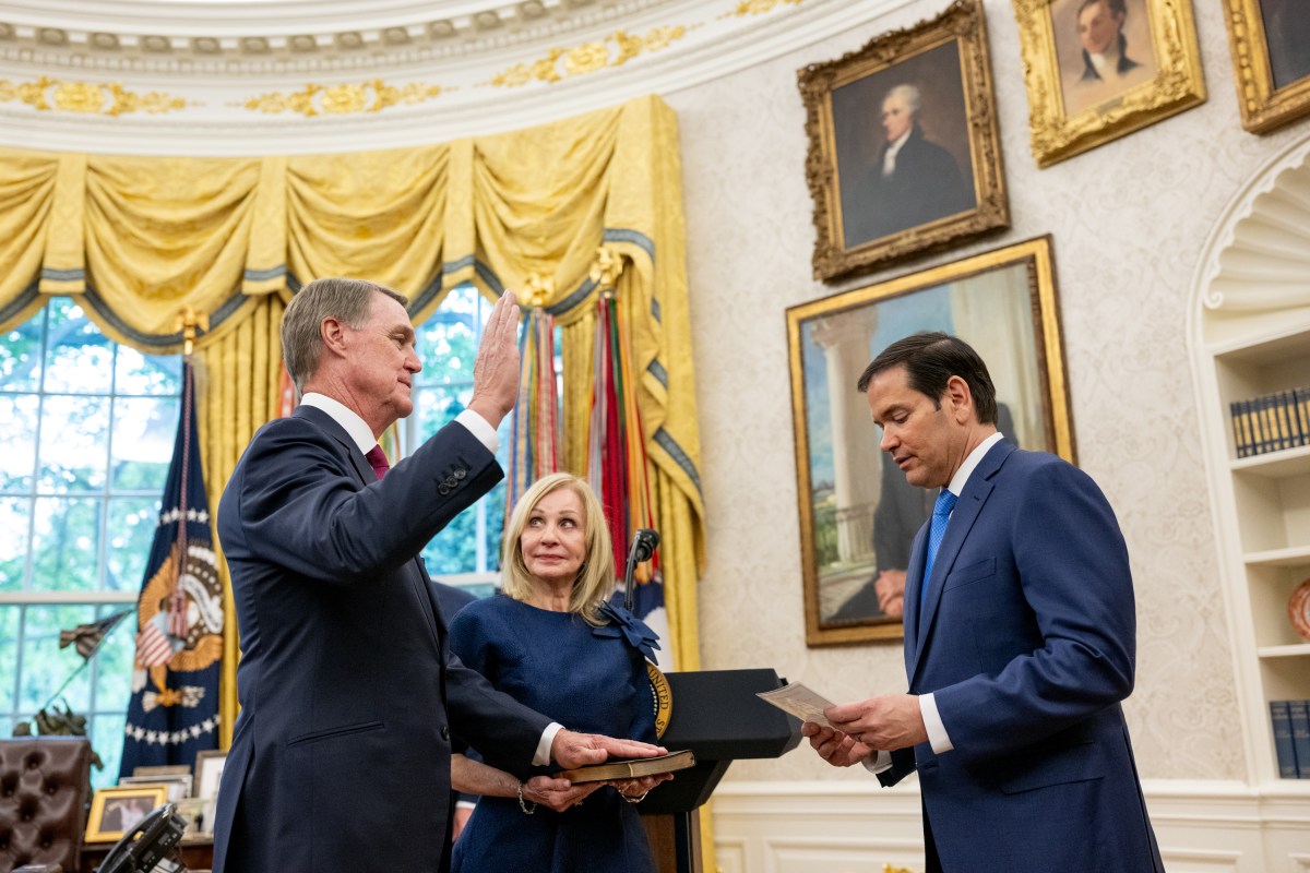 The U.S. Ambassador to China David Purdue is sworn in by Secretary of State Marco Rubio, Wednesday, May 7, 2025, in the Oval Office. (Official White House Photo by Molly Riley)