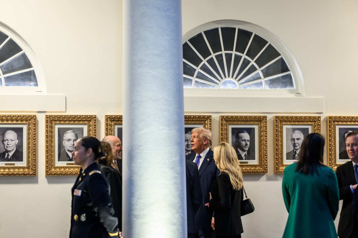 President Donald Trump speaks with Cabinet secretaries and White House staff on the West Colonnade before a dinner in the Rose Garden, Wednesday, September 24, 2025. (Official White House Photo by Molly Riley)