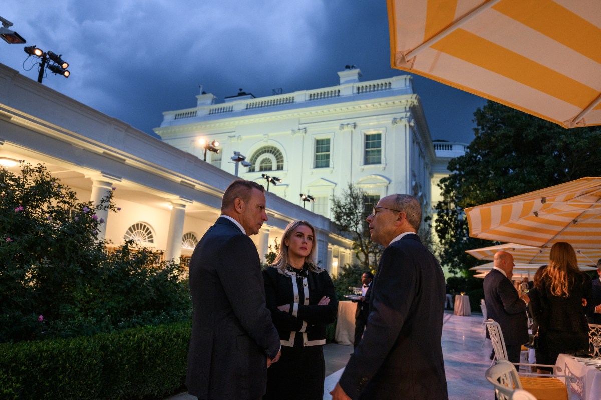 President Donald Trump speaks with Cabinet secretaries and White House staff on the West Colonnade before a dinner in the Rose Garden, Wednesday, September 24, 2025. (Official White House Photo by Molly Riley)