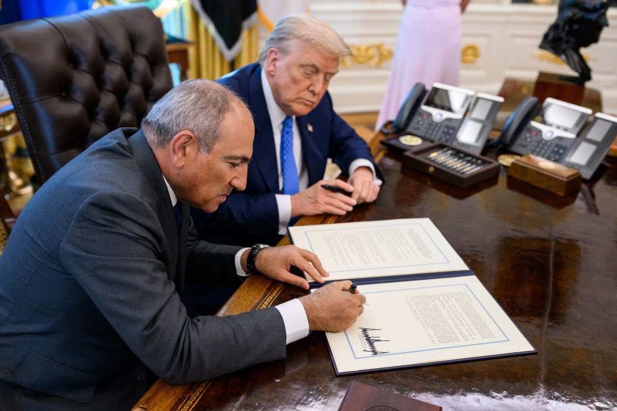 President Donald Trump signs a document alongside Prime Minister Nikol Pashinyan of Armenia in the Oval Office, Friday, August 8, 2025. (Official White House Photo by Daniel Torok)