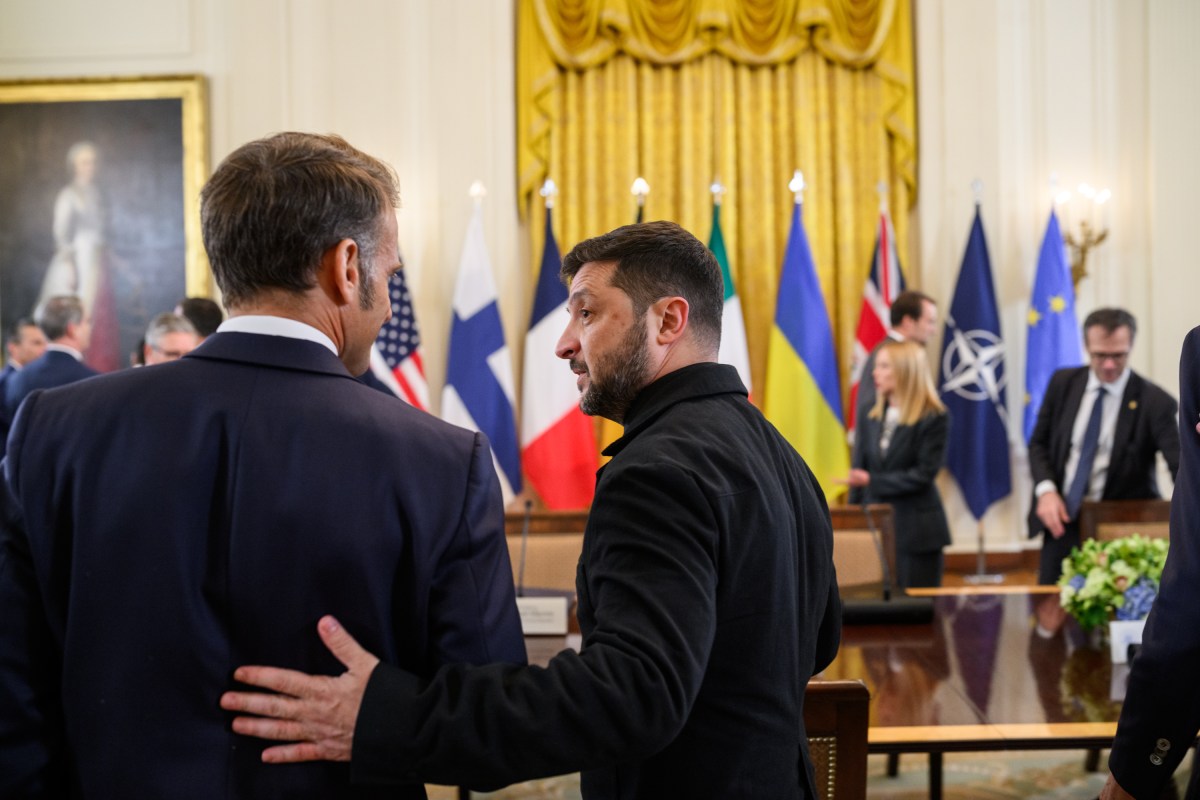 President Volodymyr Zelenskyy of Ukraine speaks with French President Emmanuel Macron during a multilateral meeting, Monday, August 18, 2025, in the East Room of the White House. (Official White House Photo by Daniel Torok)