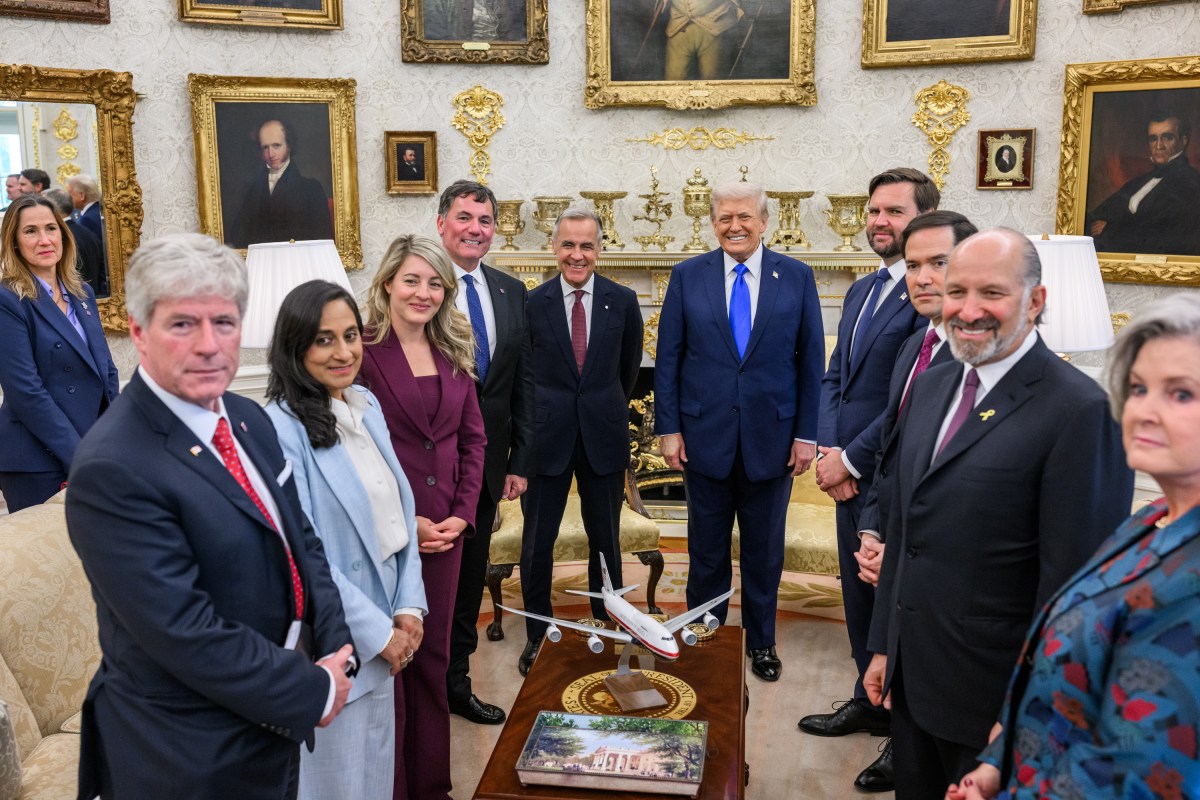 President Donald Trump poses for photos with Canadian Prime Minister Mark Carney before their meeting in the Oval Office, Tuesday, October 7, 2025. (Official White House Photo by Daniel Torok)