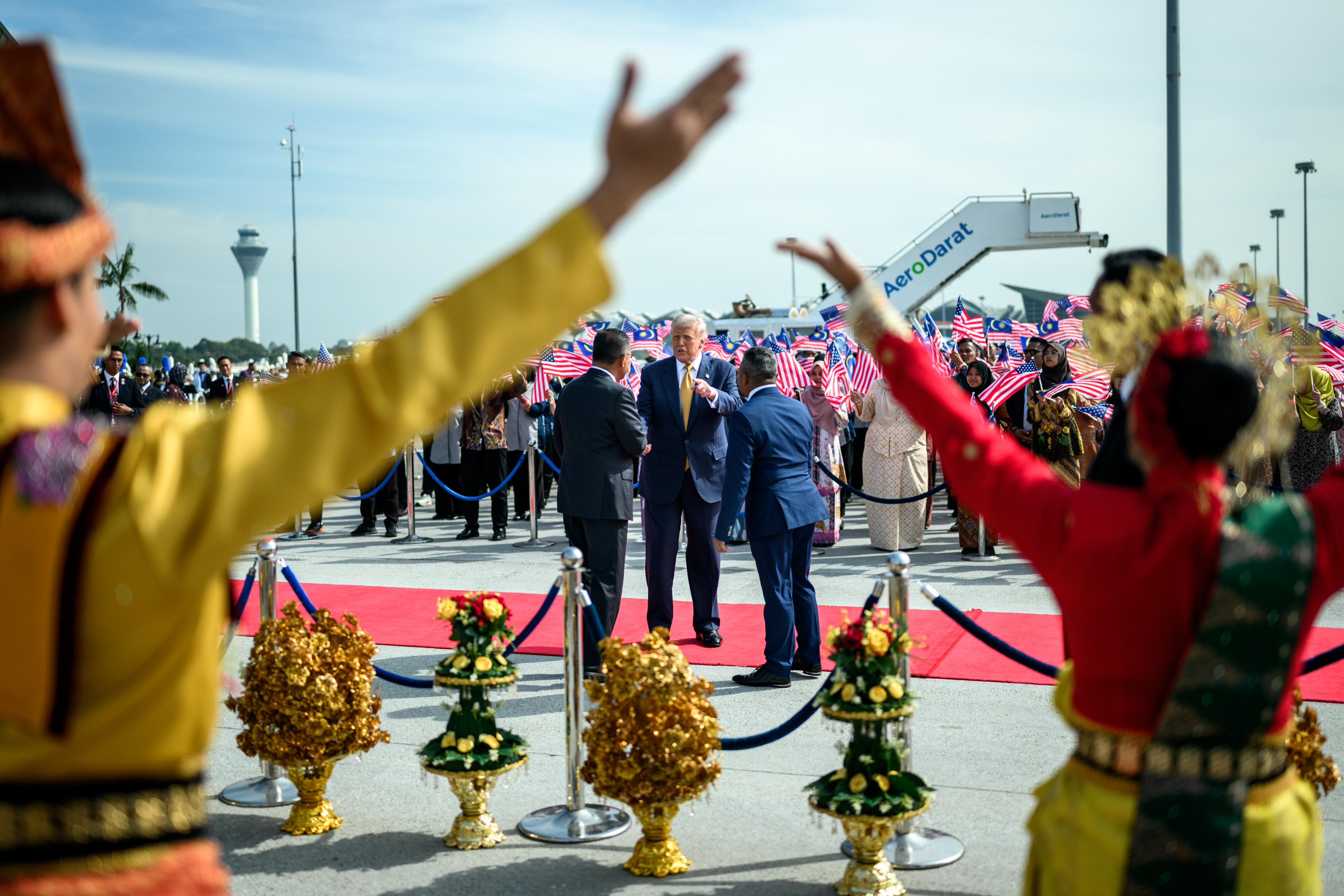 President Donald Trump bids farewell to Malaysian officials and performers gathered at Kuala Lumpur International Airport, October 27, 2025 in Kuala Lumpur, Malaysia. (Official White House Photo by Daniel Torok)