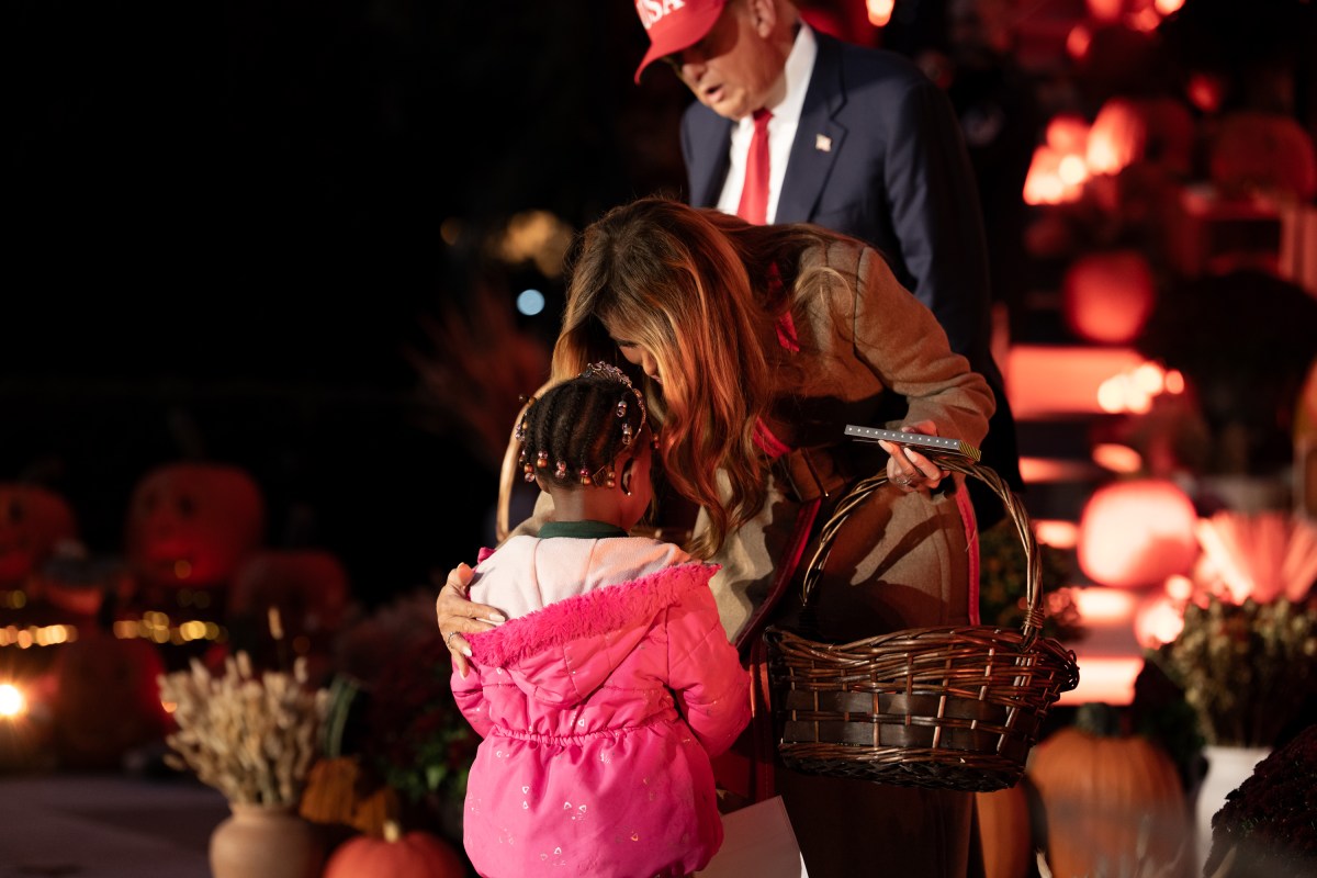 President Donald Trump and First Lady Melania Trump hand out candy to trick-or-treaters at the South Portico during Halloween celebrations at the White House, Thursday, October 30, 2025. (Official White House Photo by Andrea Hanks)