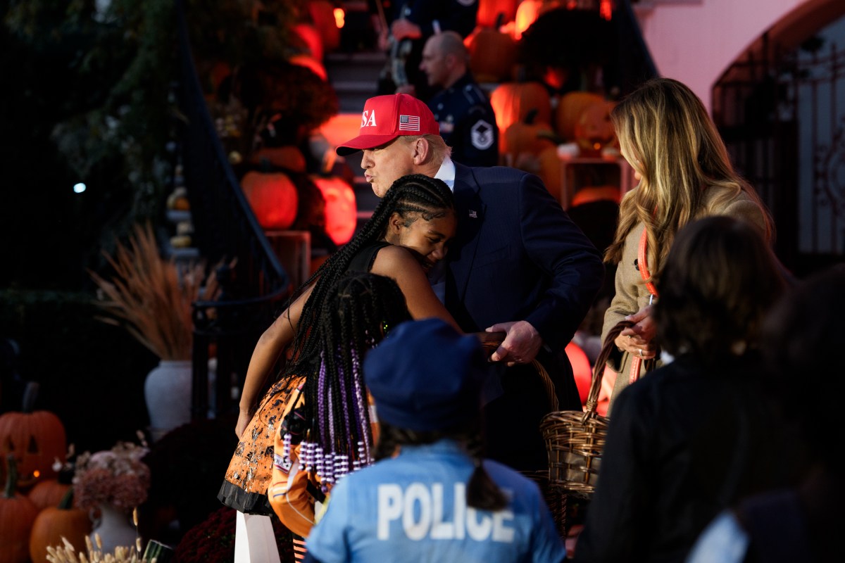 President Donald Trump and First Lady Melania Trump hand out candy to trick-or-treaters at the South Portico during Halloween celebrations at the White House, Thursday, October 30, 2025. (Official White House Photo by Andrea Hanks)