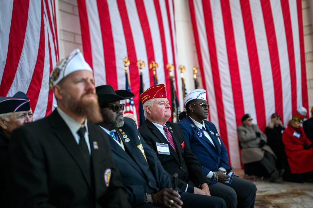 U.S. Veterans listen as President Donald Trump delivers remarks at a Veterans Day ceremony at the Memorial Amphitheater at Arlington National Cemetery, Tuesday, November 11, 2025, in Arlington, Virginia. (Official White House Photo by Daniel Torok)