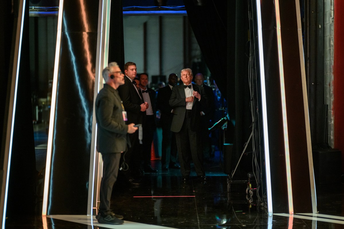 President Donald Trump reviews his speech before delivering remarks at the Kennedy Center Honors celebrating Sylvester Stallone, Gloria Gaynor, George Strait, members of KISS, and Michael Crawford at the Kennedy Center in Washington, D.C., Sunday, December 7, 2025. (Official White House Photo by Daniel Torok)