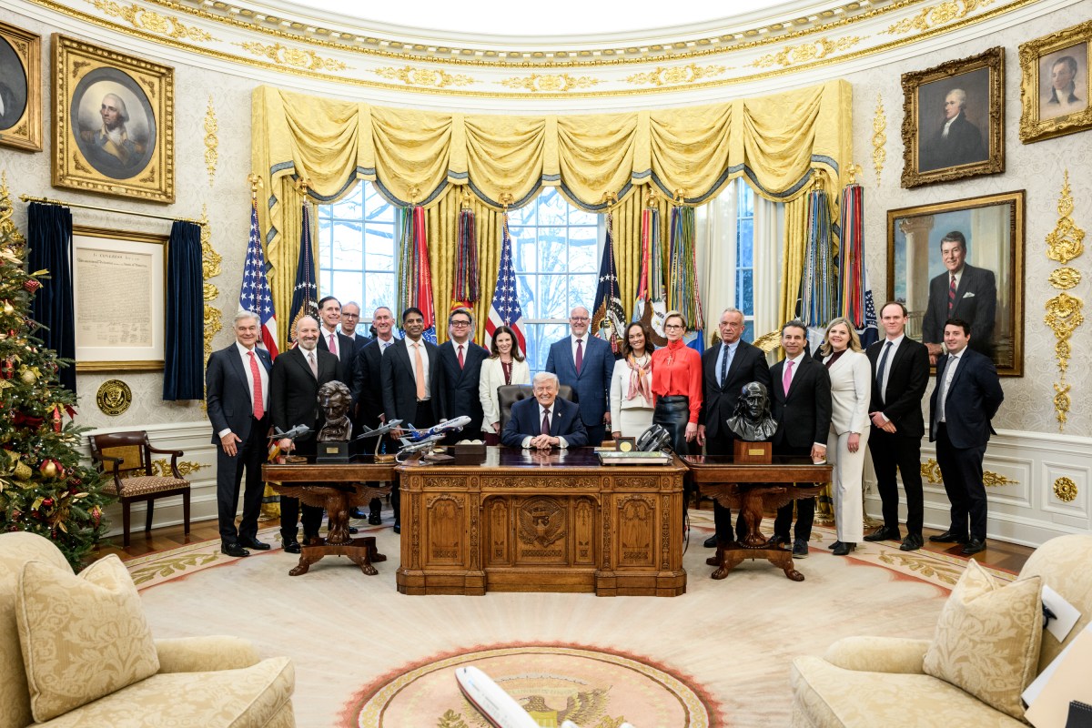 President Donald Trump poses for photos in the Oval Office after making an announcement on prescription drug prices, Friday, December 19, 2025. (Official White House Photo by Joyce N. Boghosian)