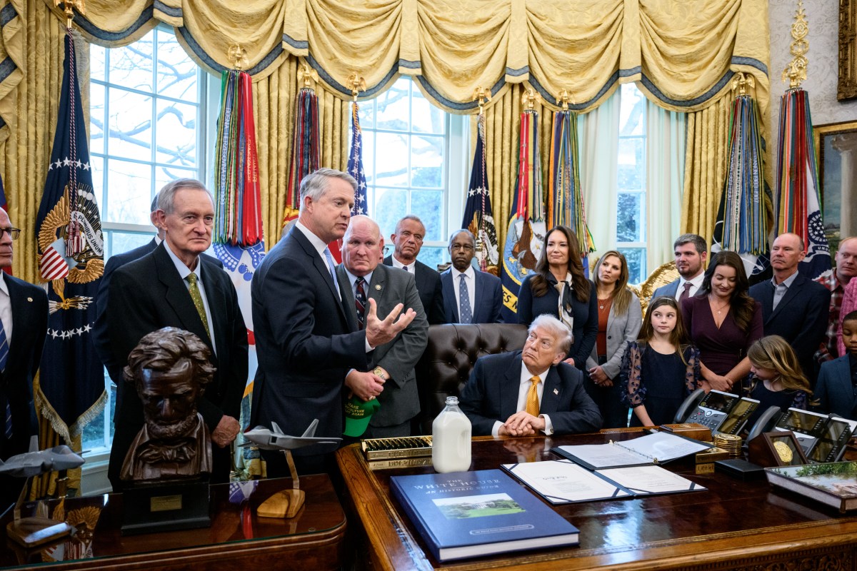 President Donald Trump signs Executive Orders including the “Whole Milk for Healthy Kids Act" alongside HHS Secretary Robert F. Kennedy, Jr., Secretary of Agriculture Brooke Rollins, and dairy farmers in the Oval Office, Wednesday, January 14, 2026. (Official White House Photo by Joyce N. Boghosian)