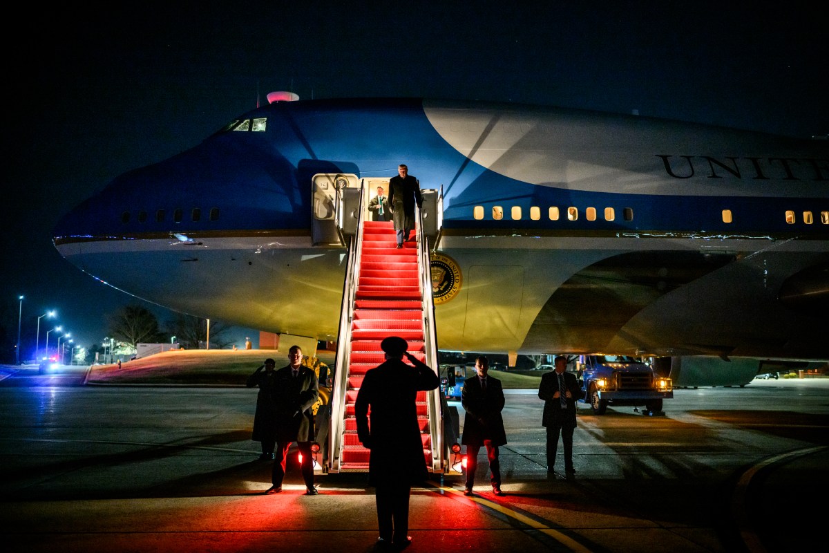 President Donald Trump disembarks Air Force One at Joint Base Andrews to board a backup plane to Davos, Switzerland, after Air Force One experienced electrical issues, Tuesday, January 20, 2026. (Official White House Photo by Daniel Torok)