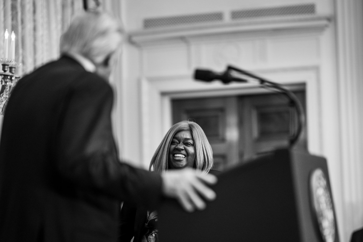 President Donald Trump welcomes business owner Arnetta Bradford to the stage at a Black History Month reception, Wednesday, February 18, 2026, in the East Room of the White House. (Official White House Photo by Joyce N. Boghosian)